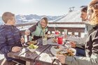 Enjoy your break from skiing on a sunny terrace with stunning views.